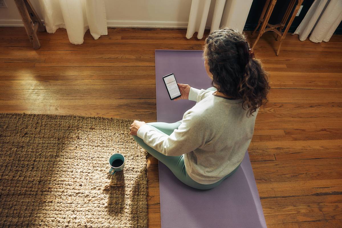 Woman practicing compassion meditation buddhify guide while commuting on train