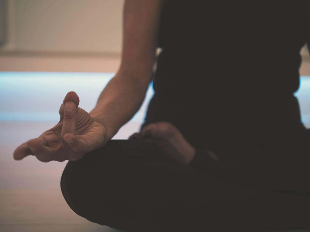 Man using meditation on the go techniques during a work break at his desk
